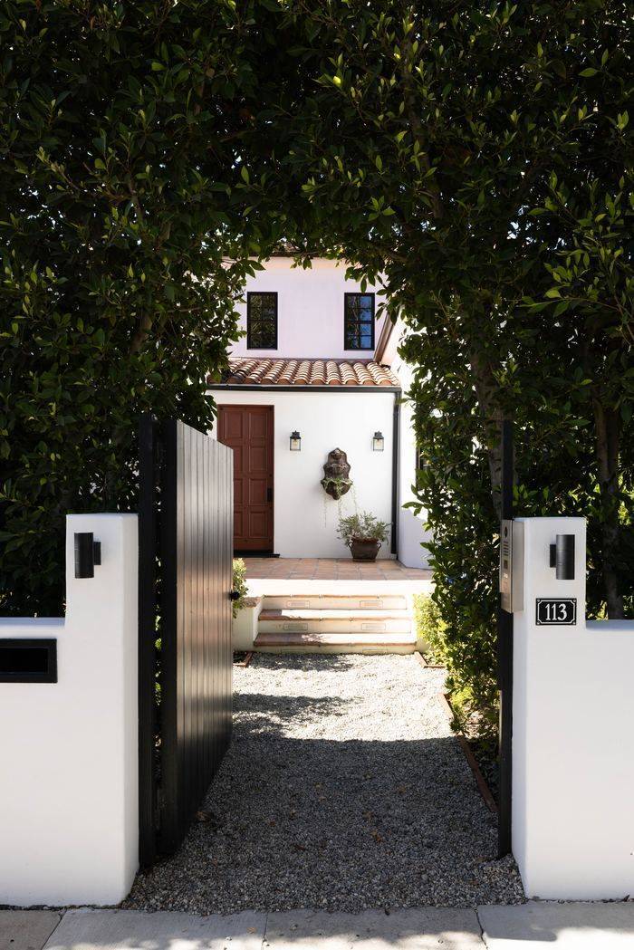 Hedged gate entry at 113 N La Jolla Avenue
