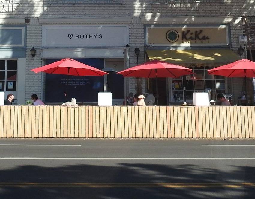 Cafe umbrellas and storefronts on Larchmont Boulevard