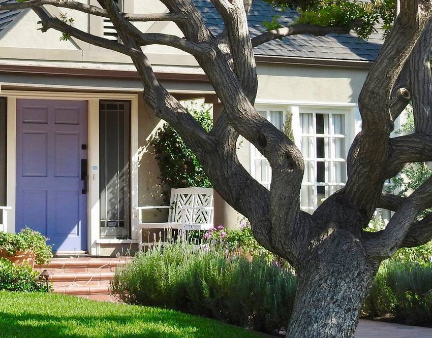 Porch, garden chair and lavender border of a 1920s Larchmont home