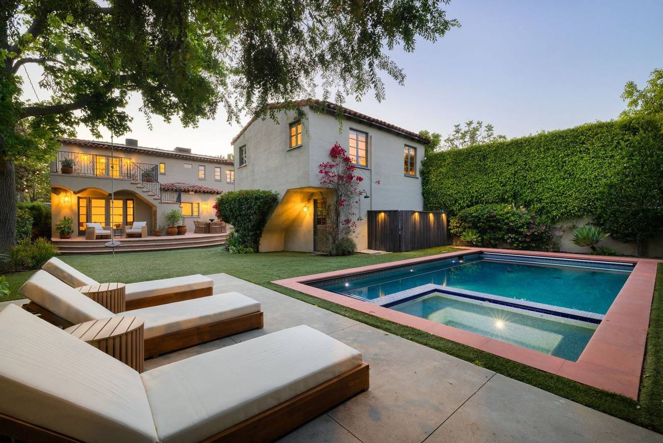 Rear elevation and pool at dusk, 146 S Martel Avenue, Miracle Mile