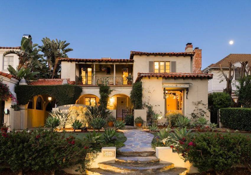 146 South Martel at dusk, a Spanish revival home in the Miracle Mile