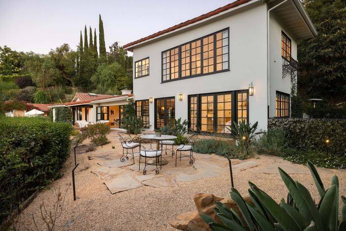 1930s two story at dusk, 3646 Sunswept Drive