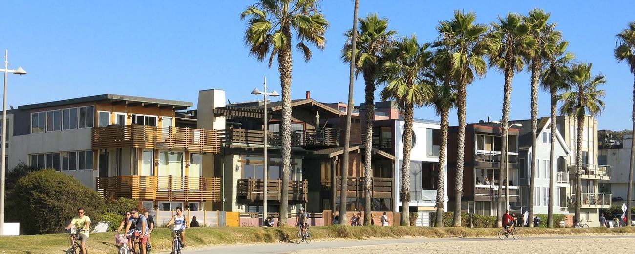 Beachfront homes and palms along the Venice boardwalk