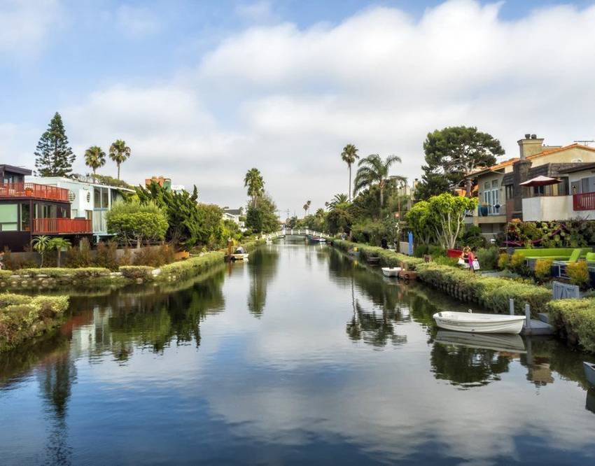 Cottages and moored boats along the Venice canals