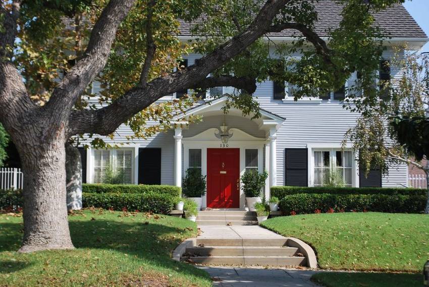 Traditional home behind a deep lawn and mature trees, Windsor Square